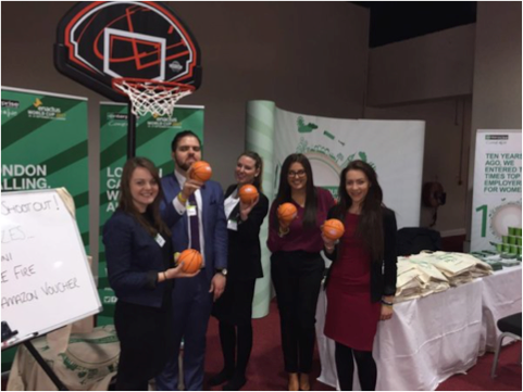 Students with mini basketballs at career fair